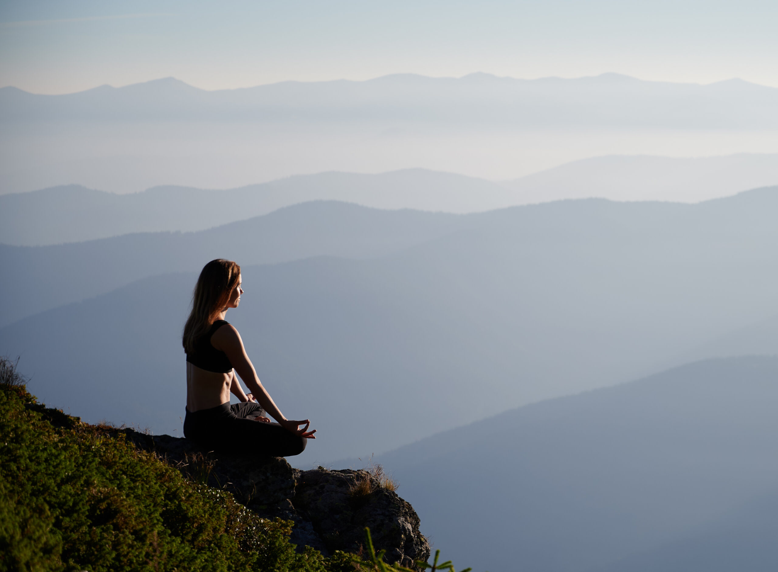Woman relaxing and meditating on fresh air.
